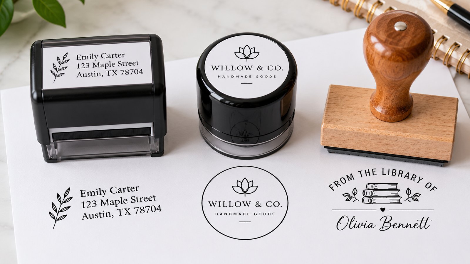 A rectangular self-inking address stamp, a round self-inking logo stamp and a wood-handled library stamp on white paper, each above its black impression